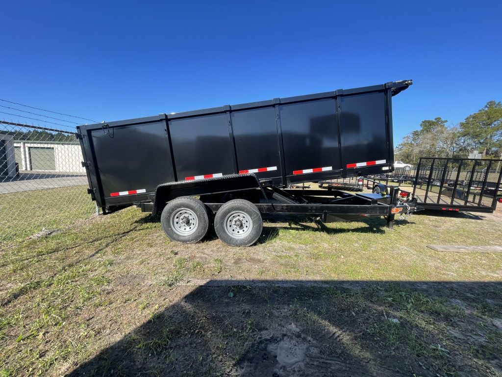 Down 2 Earth 7 foot x 14 foot dump trailer with 4ft sides, dual 7,000 lb axles, slide-in ramps, powder-coated tongue box, D-ring tie downs, and LED lighting