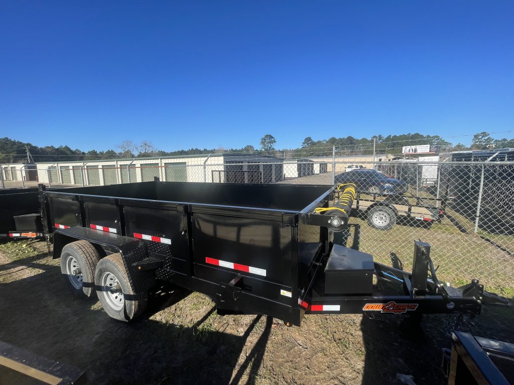 Down 2 Earth 7 foot x 14 foot dump trailer with 2ft sides, dual 7,000 lb axles, slide-in ramps, powder-coated tongue box, D-ring tie downs, and LED lighting